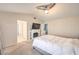 Bright main bedroom featuring neutral colors and carpet flooring at 8304 Esmont Ln, Las Vegas, NV 89117