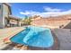 Refreshing pool view in the backyard, complemented by a well-maintained patio area for leisure at 8304 Esmont Ln, Las Vegas, NV 89117