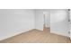 Bright bedroom with light hardwood floors, neutral paint, and ample natural light at 909 Hazard Ave, Las Vegas, NV 89108