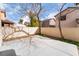 Spacious backyard with concrete patio surrounded by fencing and trees, creating a private outdoor area at 9119 Brilliant Prairie Ct, Las Vegas, NV 89149