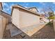 View of the home from the backyard shows the stucco exterior, neutral paint, and simple landscaping at 9119 Brilliant Prairie Ct, Las Vegas, NV 89149