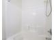 Clean, bright bathroom showcasing a tiled shower and tub combination with modern fixtures at 9119 Brilliant Prairie Ct, Las Vegas, NV 89149