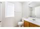 Bathroom featuring a window, tile floors and a single sink vanity at 9119 Brilliant Prairie Ct, Las Vegas, NV 89149