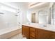 Bathroom with double sinks, a large mirror and bath and shower combo at 9119 Brilliant Prairie Ct, Las Vegas, NV 89149
