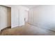 Bedroom featuring carpet, closet, and open door to bathroom area, providing ample storage at 9119 Brilliant Prairie Ct, Las Vegas, NV 89149