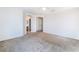 Bright bedroom with plush carpeting and open doorway to the bathroom at 9119 Brilliant Prairie Ct, Las Vegas, NV 89149