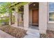 View of covered front porch with desert landscaping at 9119 Brilliant Prairie Ct, Las Vegas, NV 89149