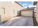View of attached two car garage with large driveway at 9119 Brilliant Prairie Ct, Las Vegas, NV 89149