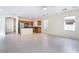 View of the eat-in kitchen and living area featuring tile floors and stainless appliances at 9119 Brilliant Prairie Ct, Las Vegas, NV 89149