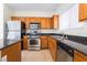 Close up of kitchen featuring stainless steel appliances and wood cabinets at 9119 Brilliant Prairie Ct, Las Vegas, NV 89149