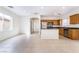 View of the eat-in kitchen and living area featuring tile floors and stainless appliances at 9119 Brilliant Prairie Ct, Las Vegas, NV 89149