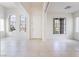 Bright living room featuring tile floors, neutral walls and arched windows at 9119 Brilliant Prairie Ct, Las Vegas, NV 89149