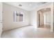 Open floorplan features a living area leading to the kitchen and entryway at 9119 Brilliant Prairie Ct, Las Vegas, NV 89149