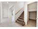 Carpeted staircase with a wooden banister leads to the second floor at 9119 Brilliant Prairie Ct, Las Vegas, NV 89149