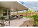 Spacious covered patio with ample seating for entertaining guests at 9675 Bold Skye Ave, Las Vegas, NV 89166