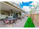 Relaxing backyard patio with comfortable seating and dining areas at 9675 Bold Skye Ave, Las Vegas, NV 89166