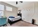 Bedroom featuring a bed, desk, and window with blinds at 9675 Bold Skye Ave, Las Vegas, NV 89166