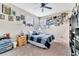 Bedroom with a bed, ceiling fan, and window at 9675 Bold Skye Ave, Las Vegas, NV 89166