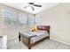 Bedroom with neutral walls, fan, and large window at 9675 Bold Skye Ave, Las Vegas, NV 89166