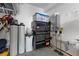 Neat garage corner with organized tools and a water heater installation at 9675 Bold Skye Ave, Las Vegas, NV 89166