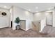 Bright hallway with neutral walls, carpet flooring, and access to multiple rooms at 9675 Bold Skye Ave, Las Vegas, NV 89166