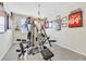 Home gym with weight machine and framed sports jersey at 9675 Bold Skye Ave, Las Vegas, NV 89166