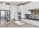 Close up of kitchen island with granite countertops, stainless steel appliances, and modern faucet at 9675 Bold Skye Ave, Las Vegas, NV 89166