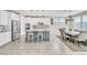 Bright open kitchen features a large island, white cabinets, and stainless appliances at 9675 Bold Skye Ave, Las Vegas, NV 89166