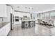 Open kitchen and dining area features a large island with bar seating at 9675 Bold Skye Ave, Las Vegas, NV 89166