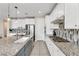 Modern kitchen features granite countertops, stainless steel appliances, and a stylish backsplash at 9675 Bold Skye Ave, Las Vegas, NV 89166