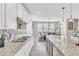 Bright kitchen with granite countertops, stainless steel appliances, island and view of dining area at 9675 Bold Skye Ave, Las Vegas, NV 89166