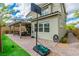 Backyard patio featuring a basketball hoop, brickwork, and covered seating at 9675 Bold Skye Ave, Las Vegas, NV 89166