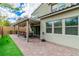 Beautiful brick patio with covered seating area and well-maintained landscaping at 9675 Bold Skye Ave, Las Vegas, NV 89166