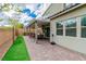 Beautiful brick patio with covered seating area and well-maintained landscaping at 9675 Bold Skye Ave, Las Vegas, NV 89166