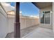Enclosed back patio area with stone landscaping and privacy fence at 10429 Amber Night St, Las Vegas, NV 89183
