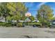 Outdoor basketball court with a hoop surrounded by green landscaping at 10429 Amber Night St, Las Vegas, NV 89183
