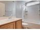 This bathroom features a bathtub with shower, sink, and tile flooring at 10429 Amber Night St, Las Vegas, NV 89183