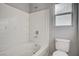 Close-up of a clean bathroom featuring a tub and window at 10429 Amber Night St, Las Vegas, NV 89183