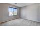 This bedroom features a window with neighborhood views at 10429 Amber Night St, Las Vegas, NV 89183