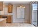 Dining area featuring granite countertops, tile flooring, a chandelier, and sliding door access at 10429 Amber Night St, Las Vegas, NV 89183