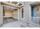 Exterior of home with attached garage, blue door, and neutral stucco at 10429 Amber Night St, Las Vegas, NV 89183
