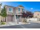 Charming two-story home with desert landscaping, and a brown garage door at 10429 Amber Night St, Las Vegas, NV 89183