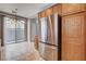Kitchen features stainless steel refrigerator and access to a backyard patio at 10429 Amber Night St, Las Vegas, NV 89183