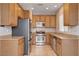 Open kitchen with stainless steel appliances and ample cabinet space at 10429 Amber Night St, Las Vegas, NV 89183