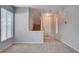 Spacious living room featuring neutral paint and flooring with a staircase and tile entry at 10429 Amber Night St, Las Vegas, NV 89183