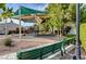 Community playground featuring shaded play equipment and nearby benches at 10429 Amber Night St, Las Vegas, NV 89183