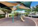 Community playground with shade structure and play equipment at 10429 Amber Night St, Las Vegas, NV 89183