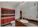 Bathroom features a granite counter, decorative shower curtain, and white toilet at 1055 Admiral Emblem St, Henderson, NV 89015