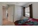 View of bedroom featuring carpet, a closet, and windows at 1055 Admiral Emblem St, Henderson, NV 89015