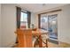 Cozy eat in kitchen features a wood dining table near a window and a glass door to the patio at 1055 Admiral Emblem St, Henderson, NV 89015